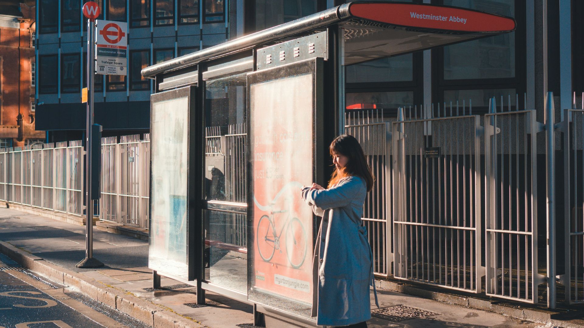 woman in white dress standing near building during daytime
