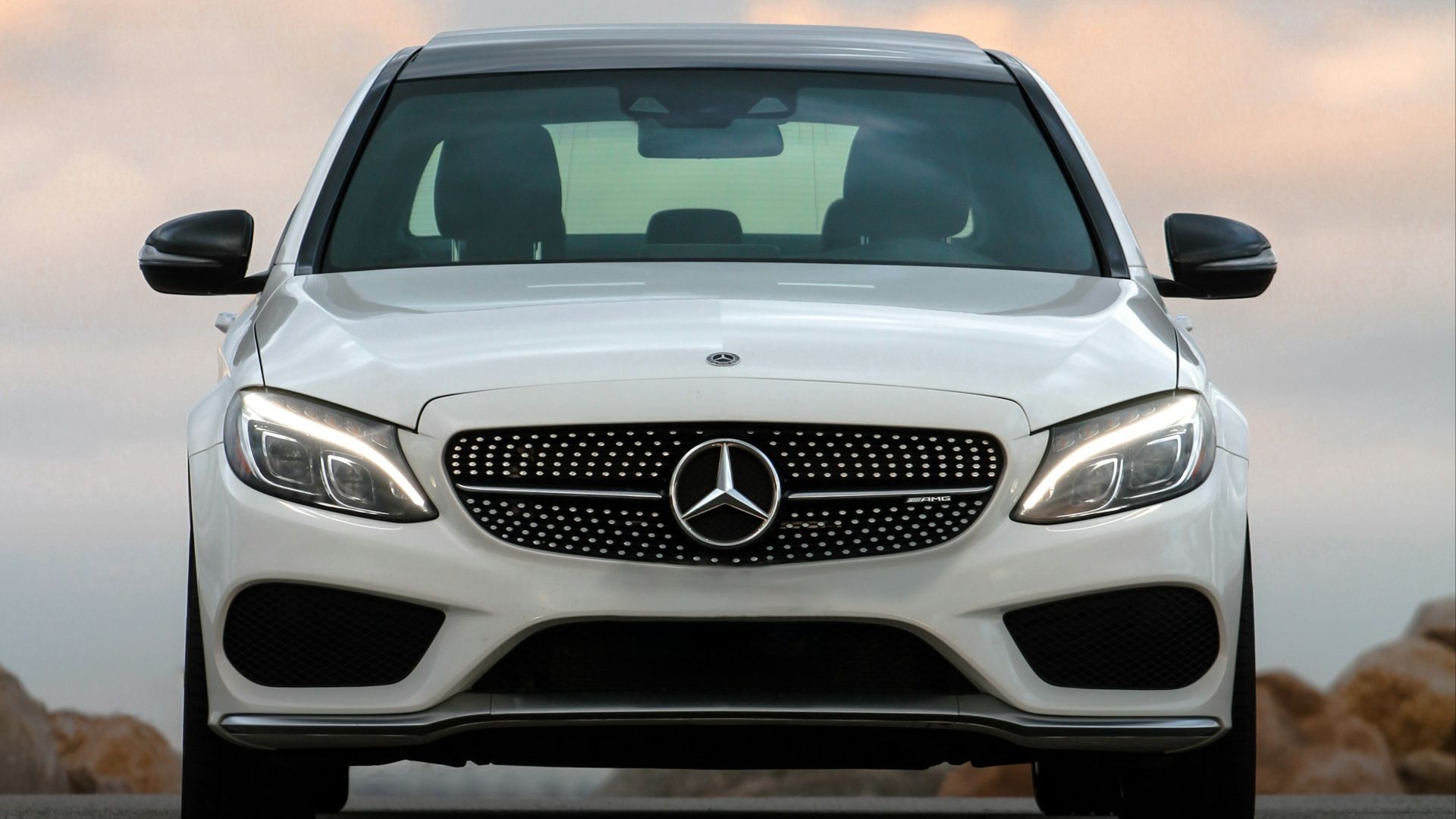 white mercedes benz car on road during daytime