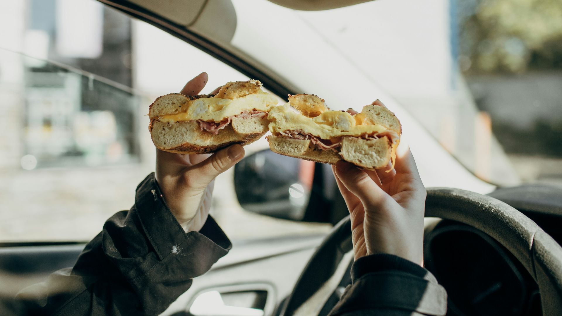 person holding bread with meat