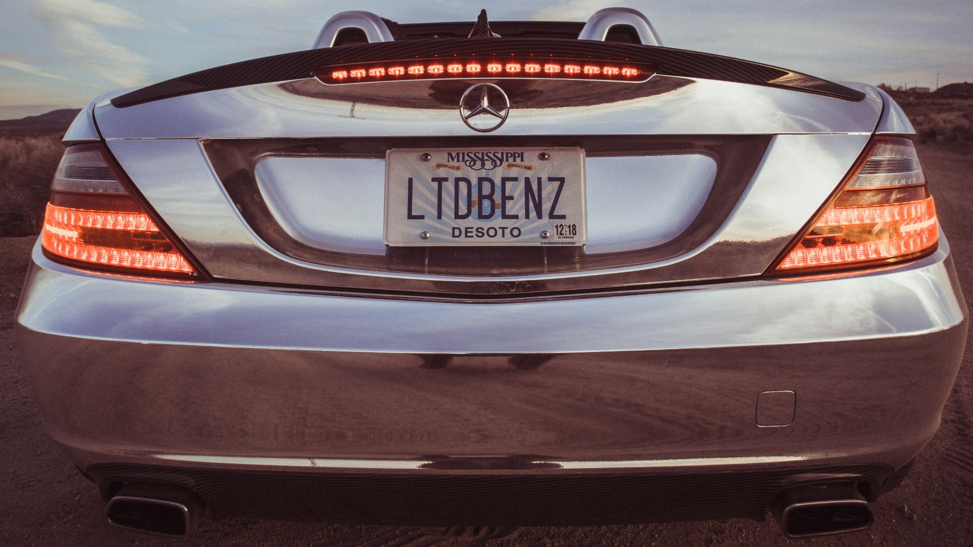 silver Mercedes-Benz car with LTDBENZ license plate