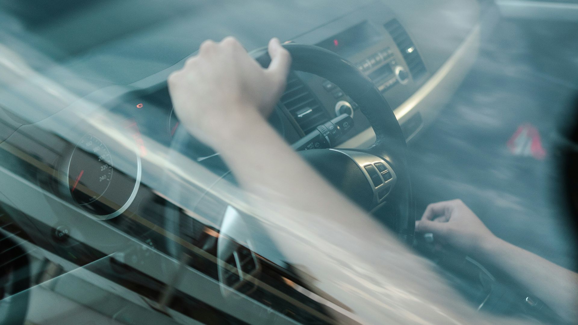 person driving car during daytime