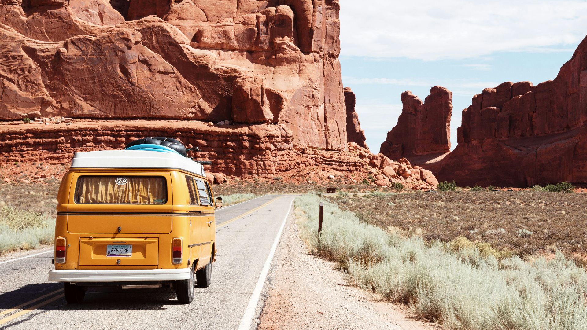 yellow Volkswagen van on road