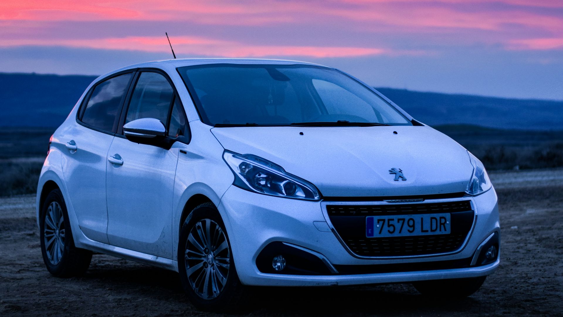 silver honda sedan on brown sand during sunset