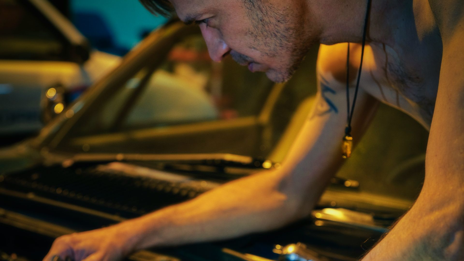 man in black tank top wearing black sunglasses