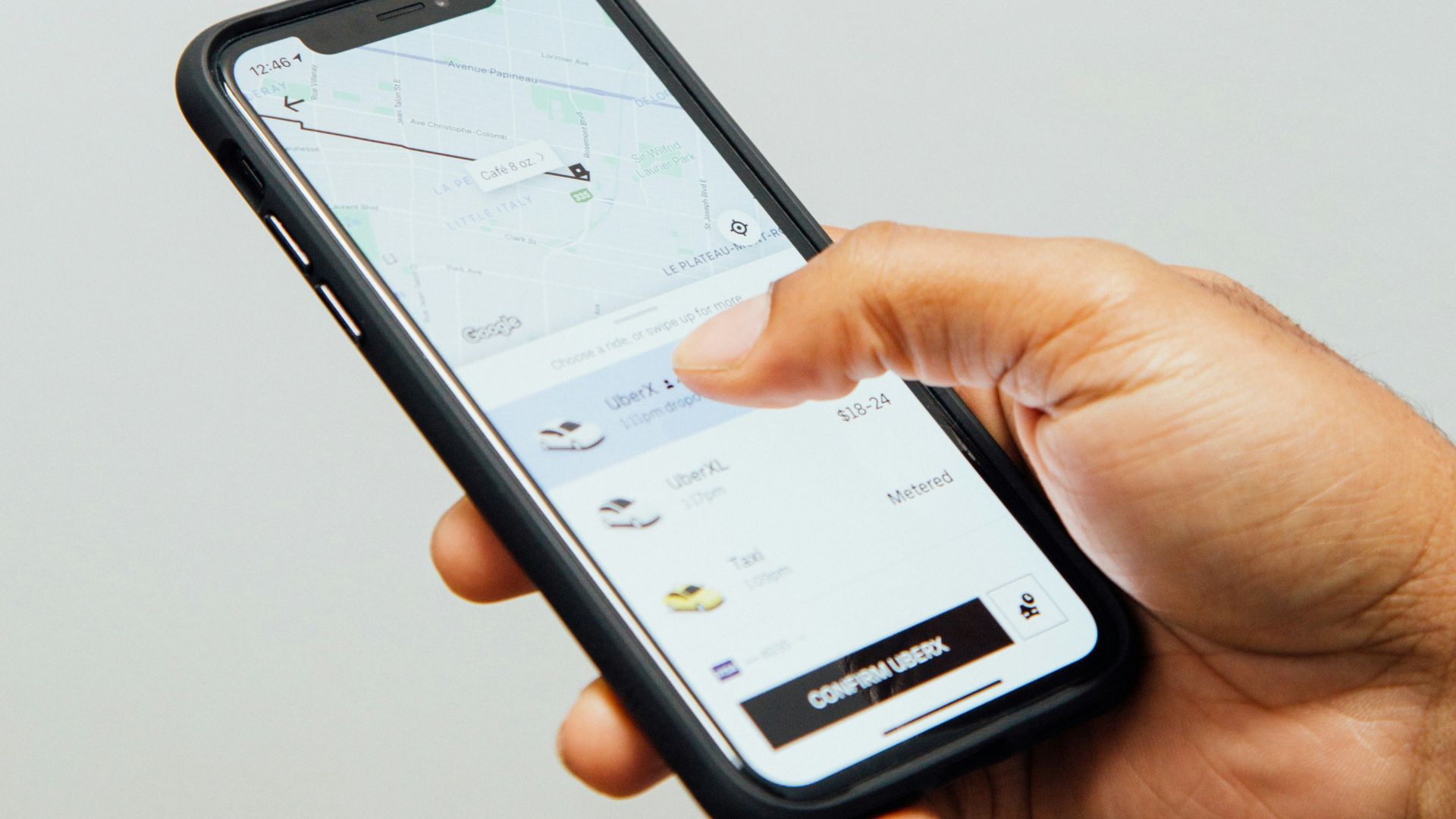 a person holding a cell phone in their hand