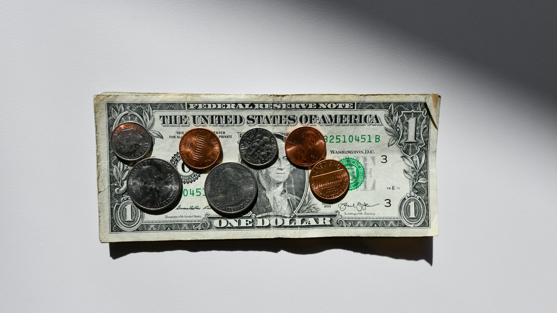 silver and gold round coins in box
