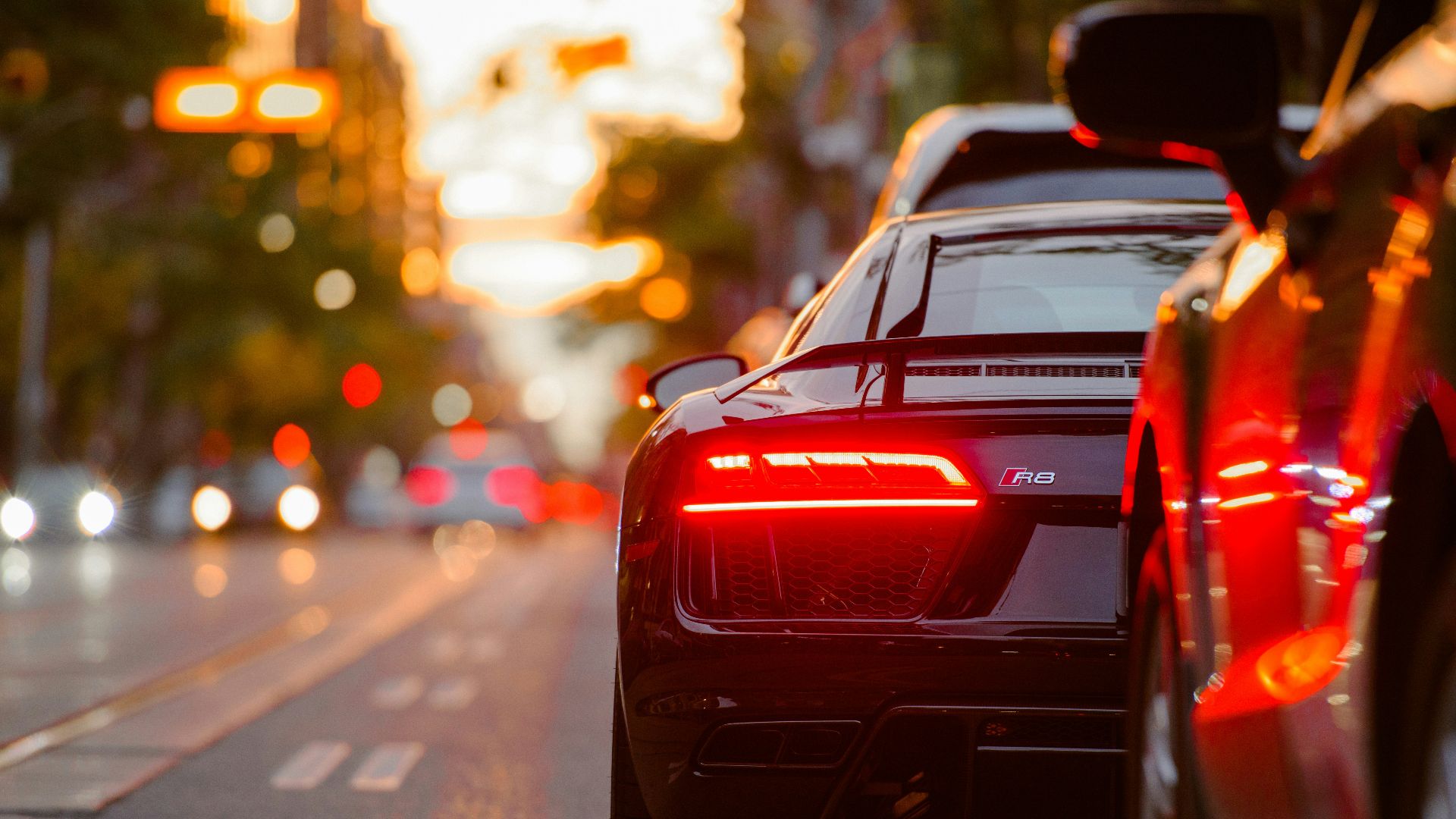 black Audi R8 parked beside road