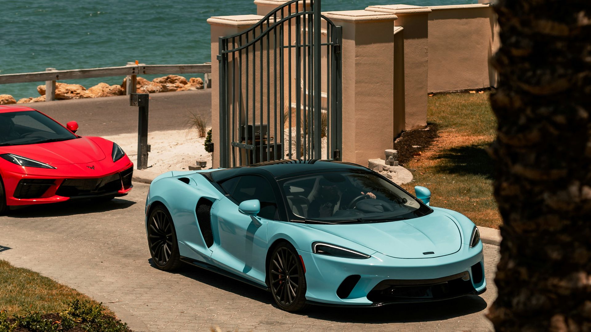 white porsche 911 parked near beach during daytime
