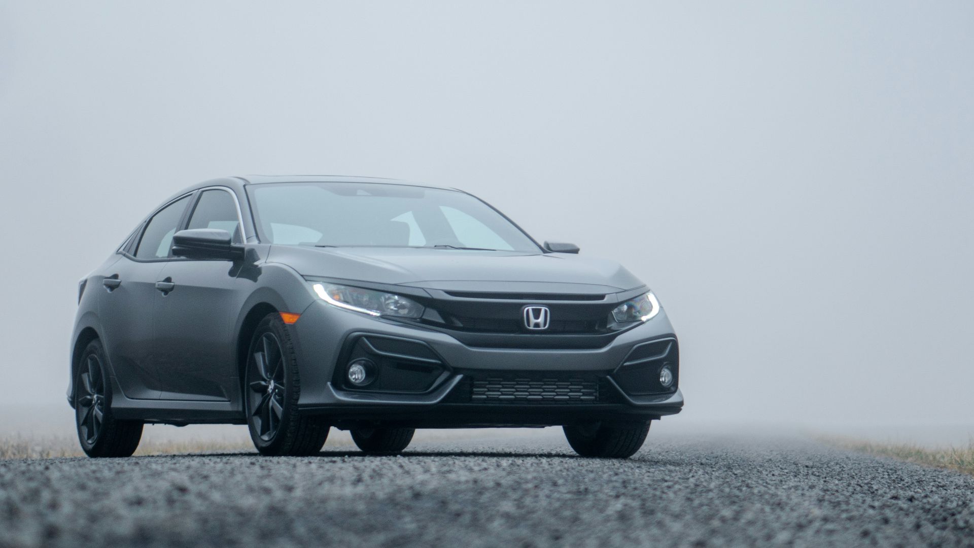 gray Honda sedan parked on road during day