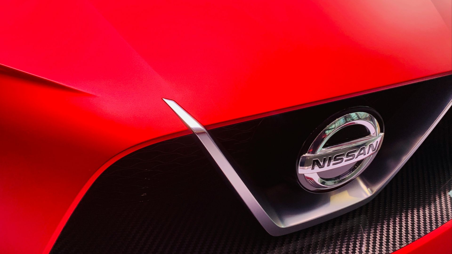 red Nissan vehicle