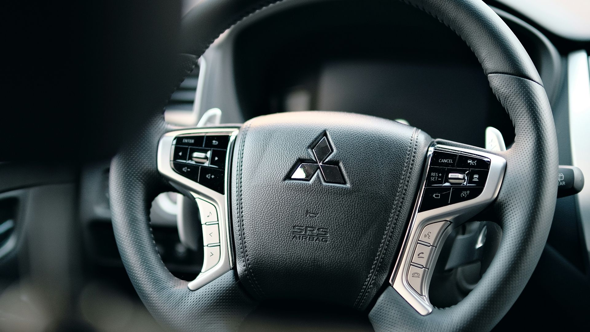 black honda steering wheel in close up photography