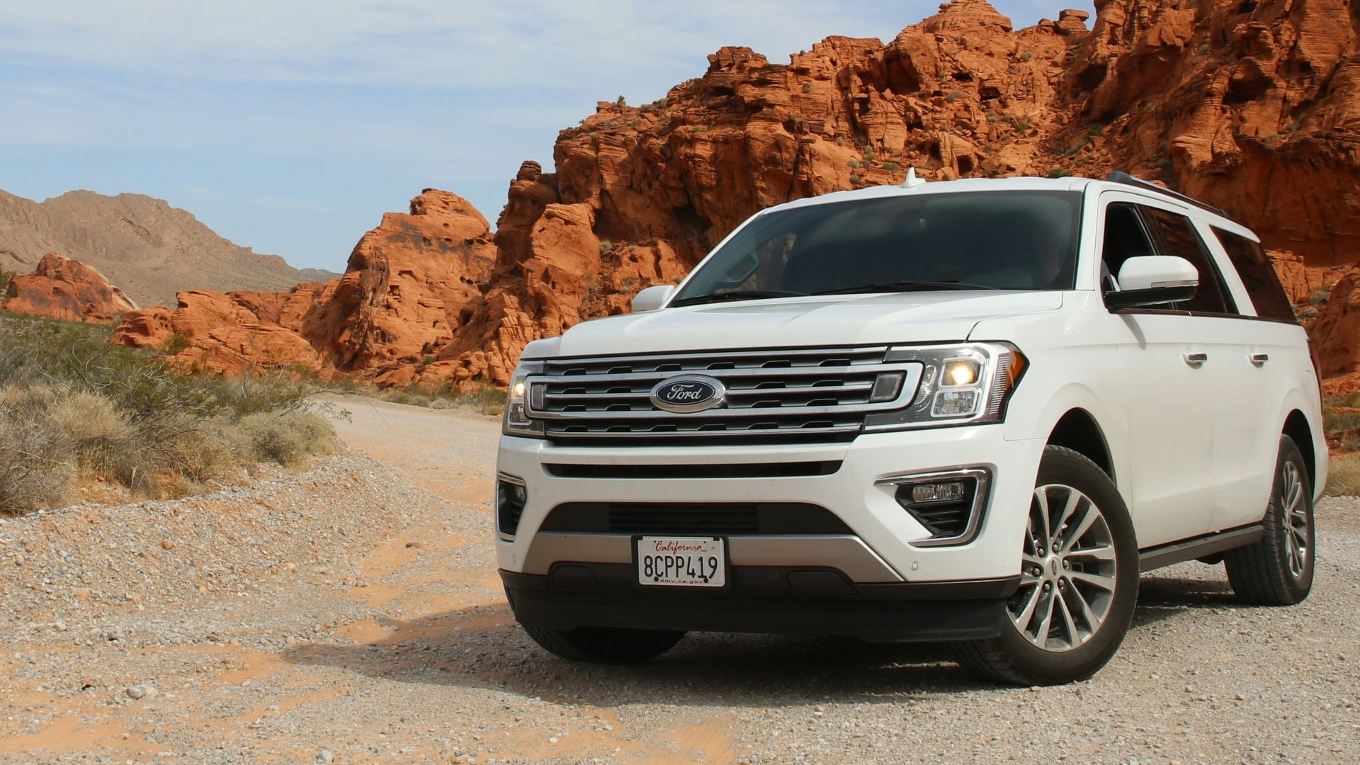 parked white Ford Explorer SUV