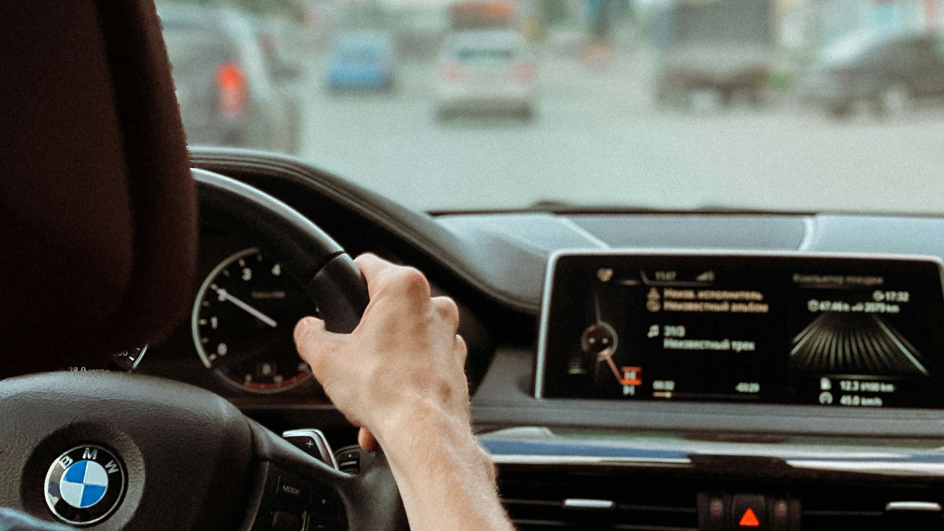 person driving car during daytime