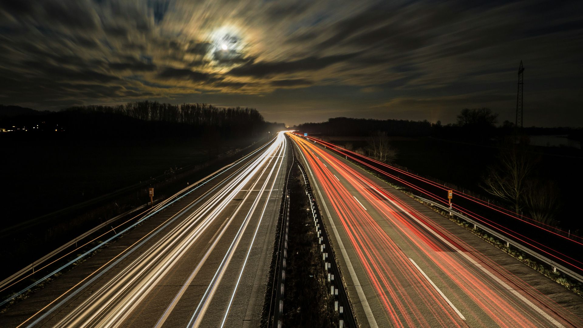 long exposure photography of vehicles at night time