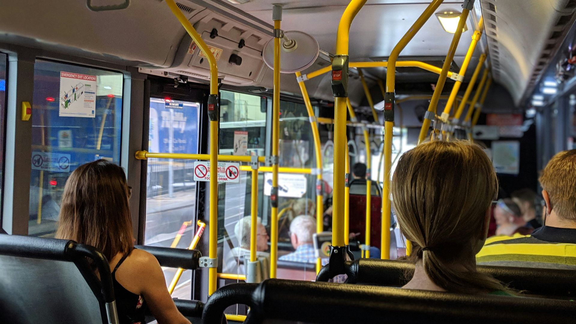 people sitting down inside vehicle
