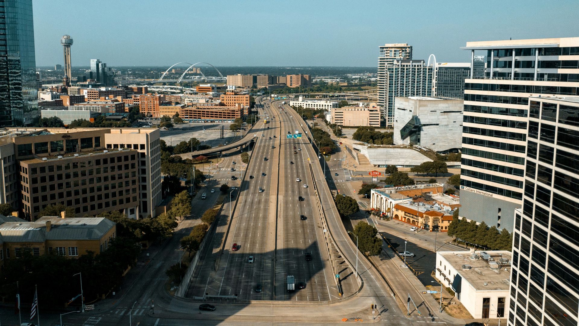 an aerial view of a city with tall buildings