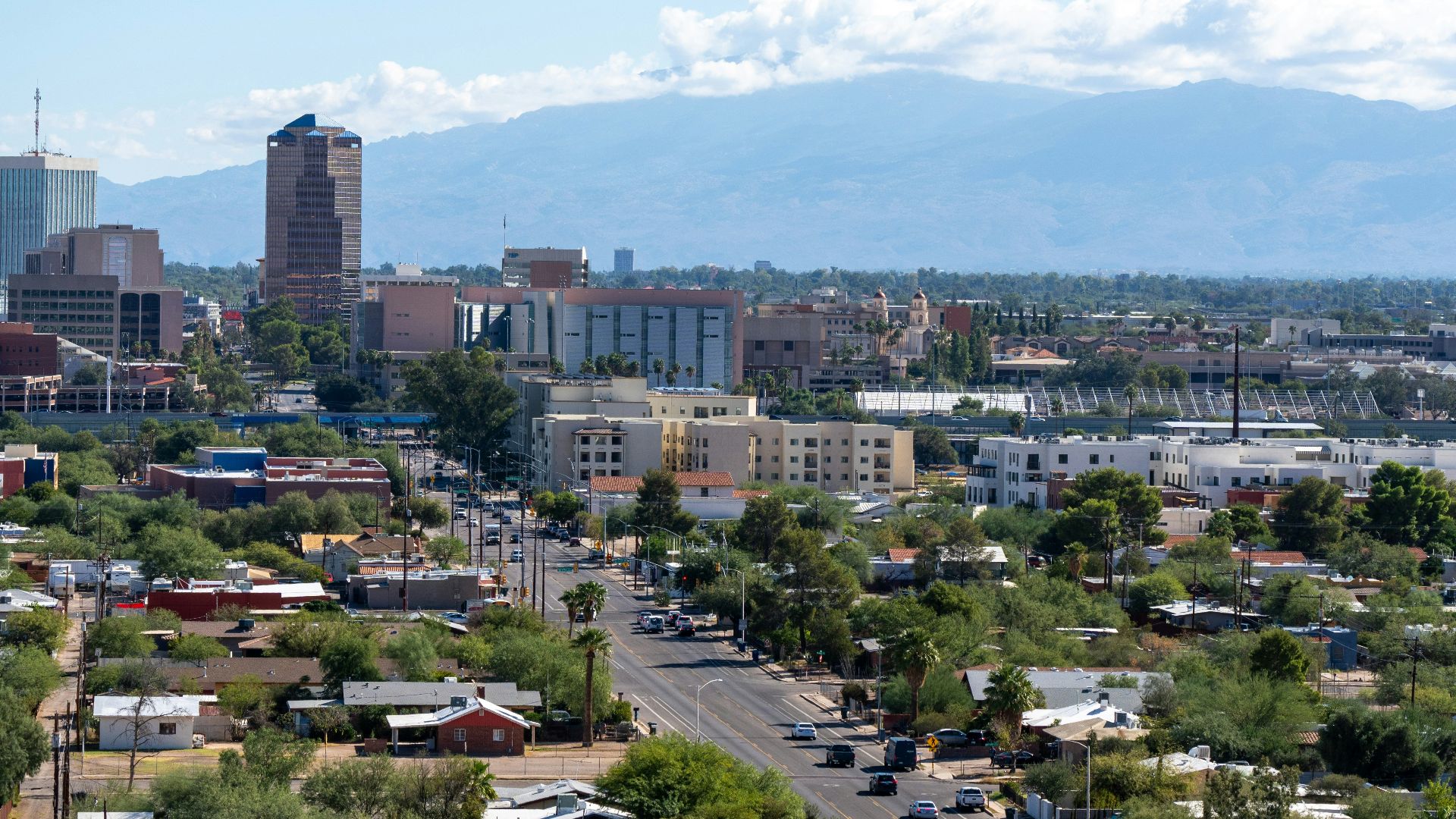 a view of a city with mountains in the background