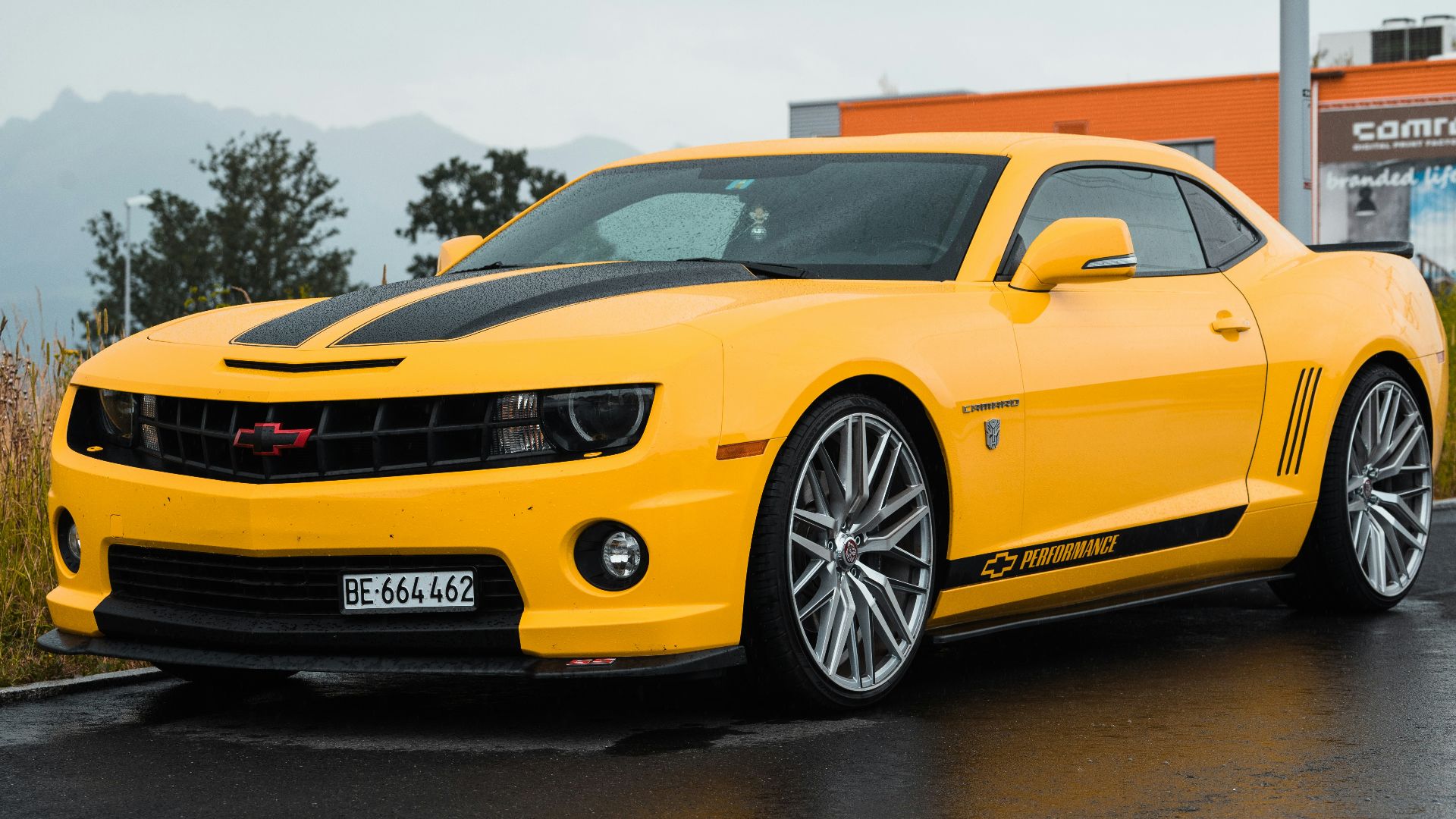 yellow Chevrolet coupe close-up photography