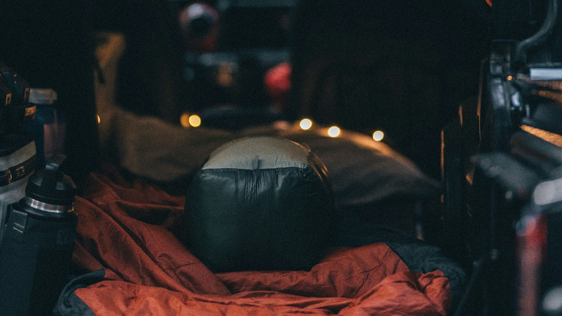 man in blue t-shirt sitting on black car seat