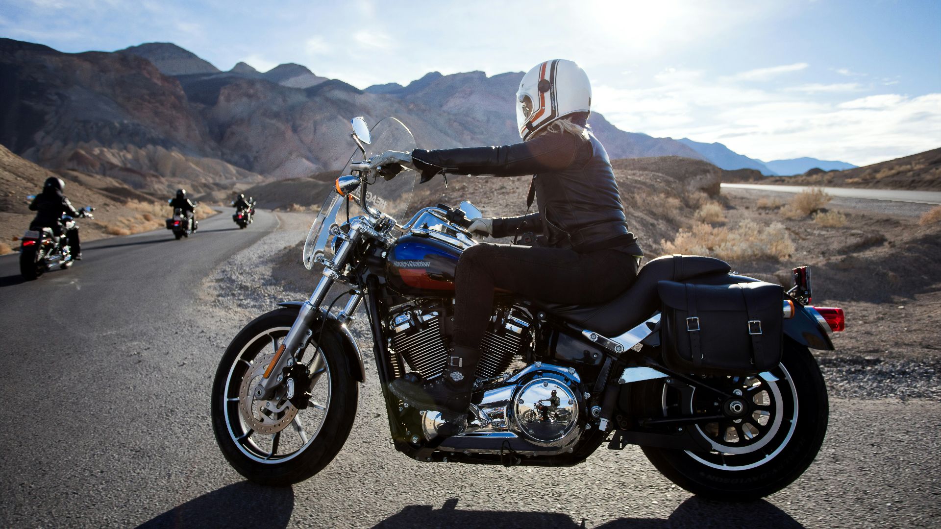 man riding touring motorcycle during daytime