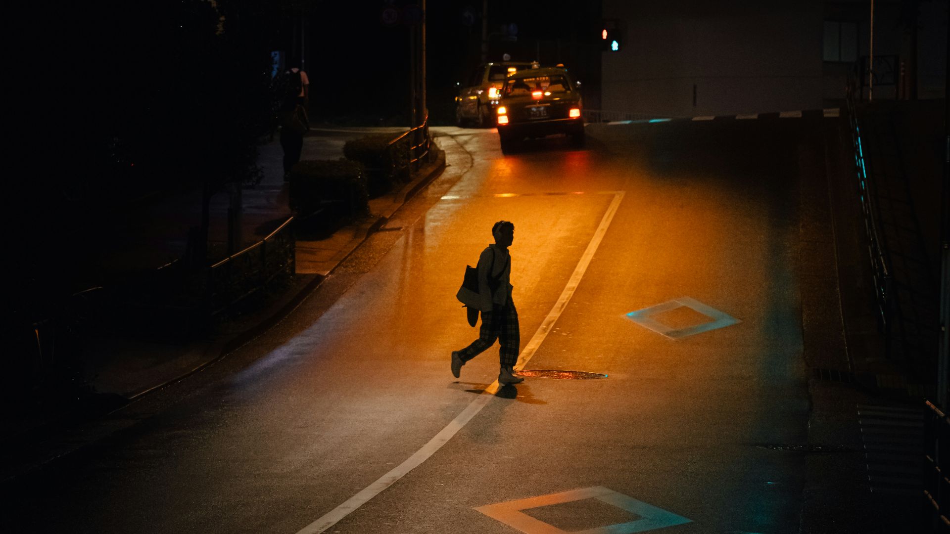 person walking on road