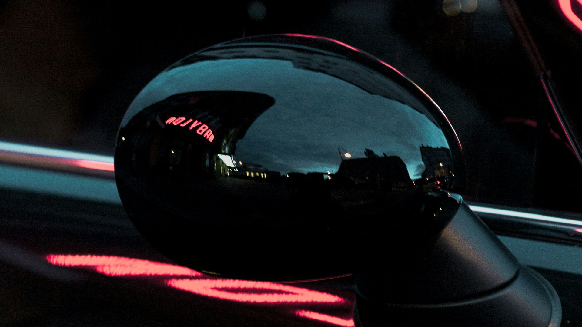 black vehicle wing mirror during nighttime