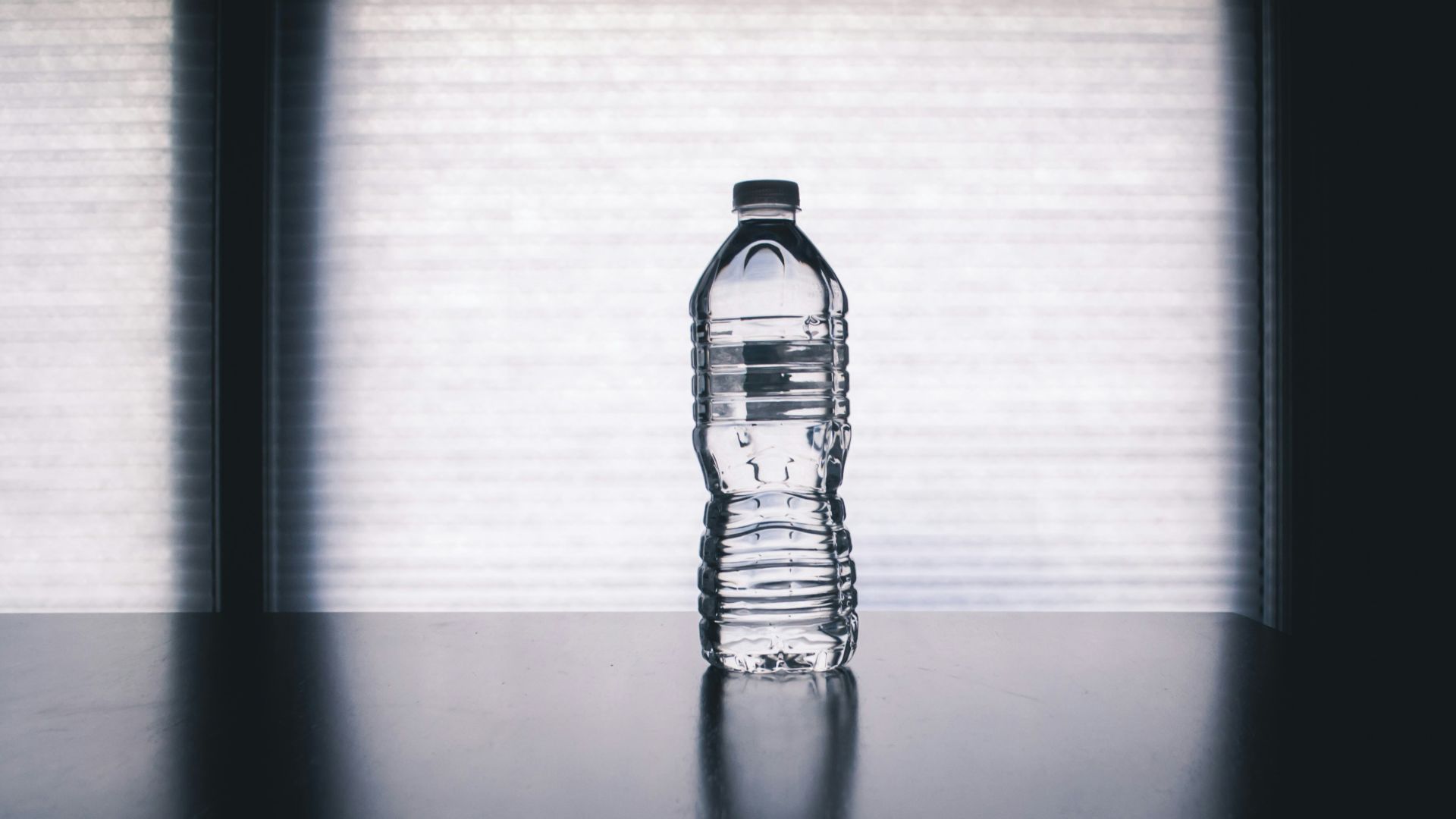 clear drinking bottle filled with water