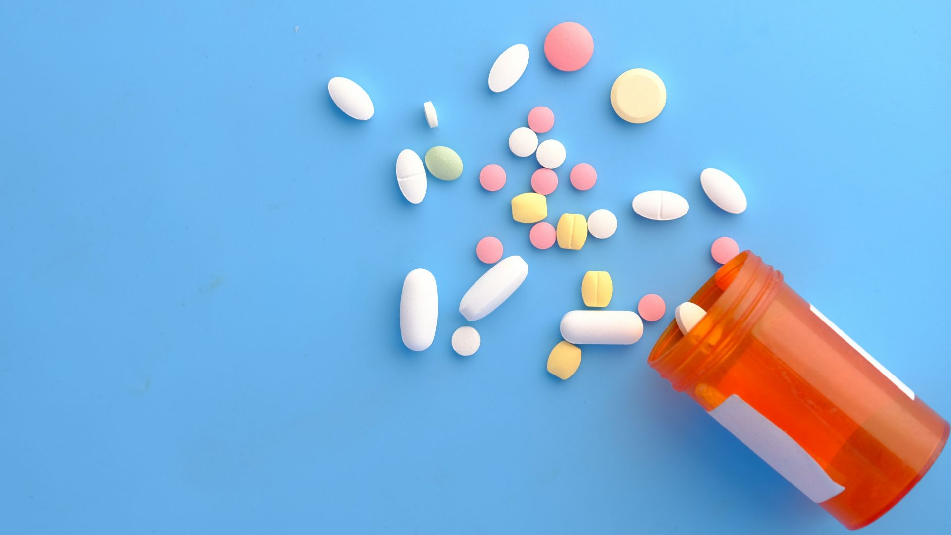 orange and white medication pill