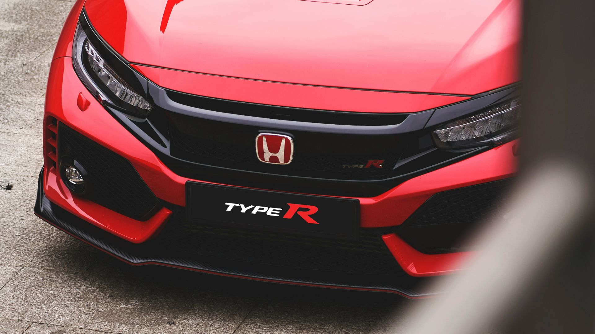 red Honda vehicle