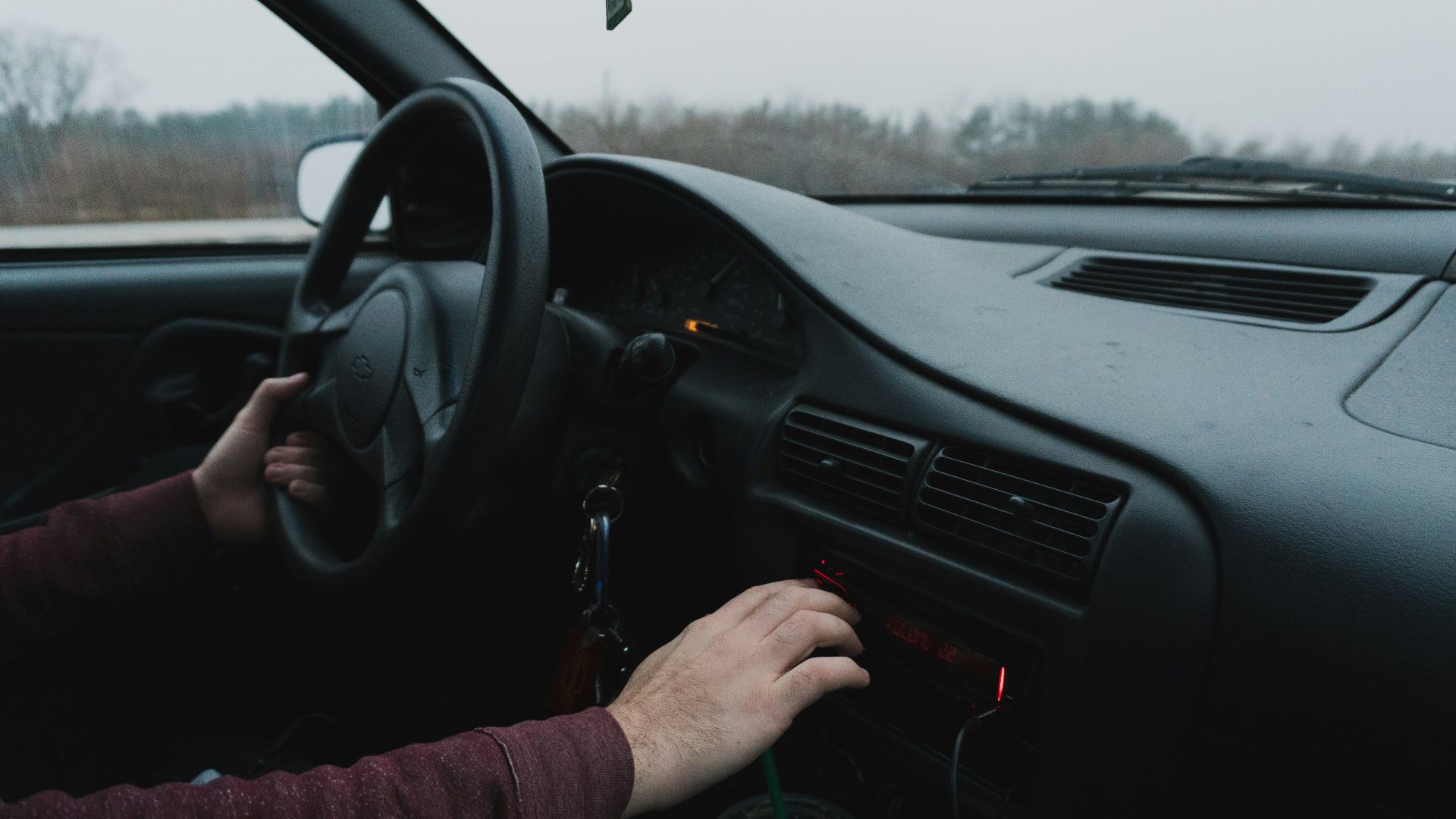 person driving black car