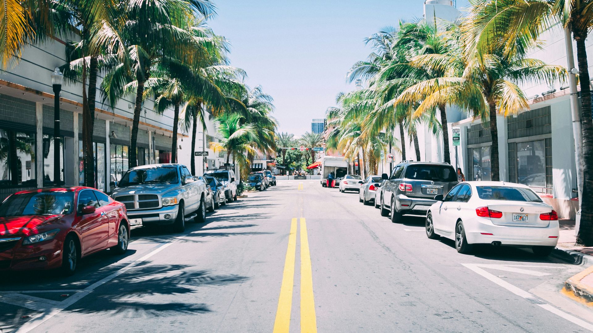 assorted cars parked side-by-side parking lot