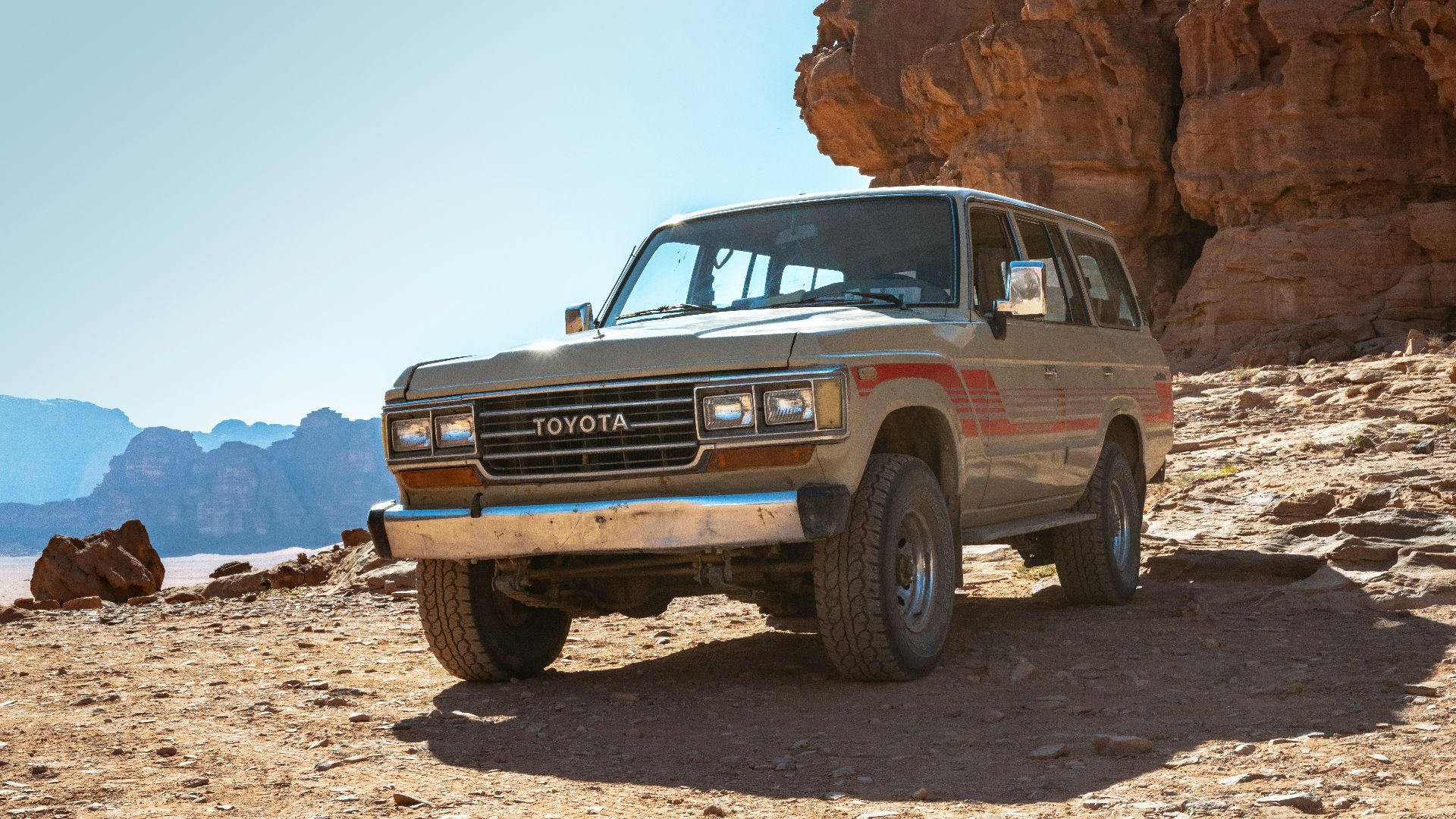 silver Toyota Land Cruiser parked on ground during daytime