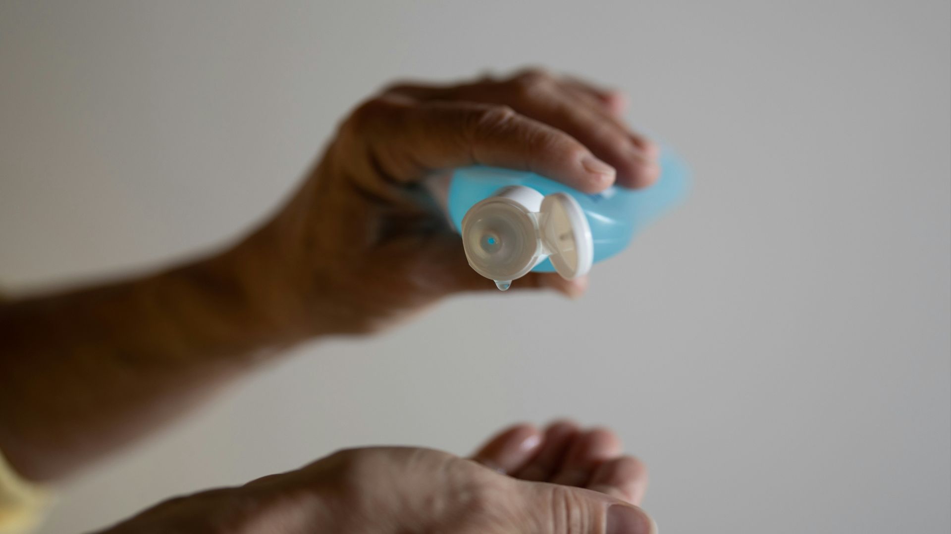 person holding white round ornament