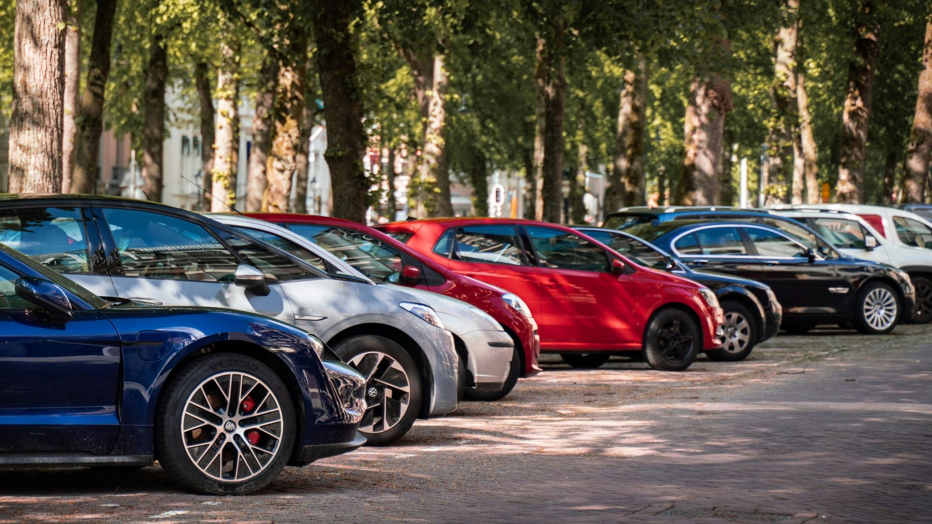 blue and red sports car on road during daytime