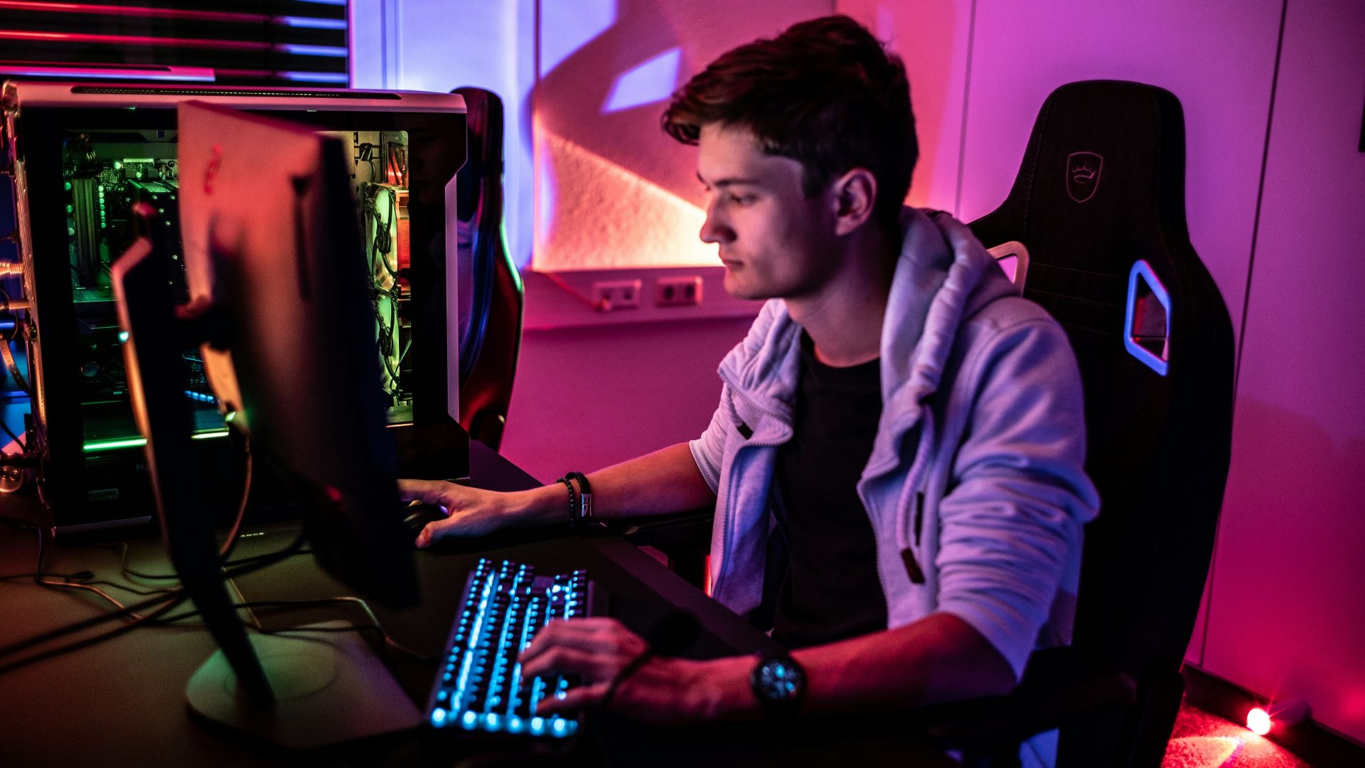 a man sitting in front of a computer keyboard