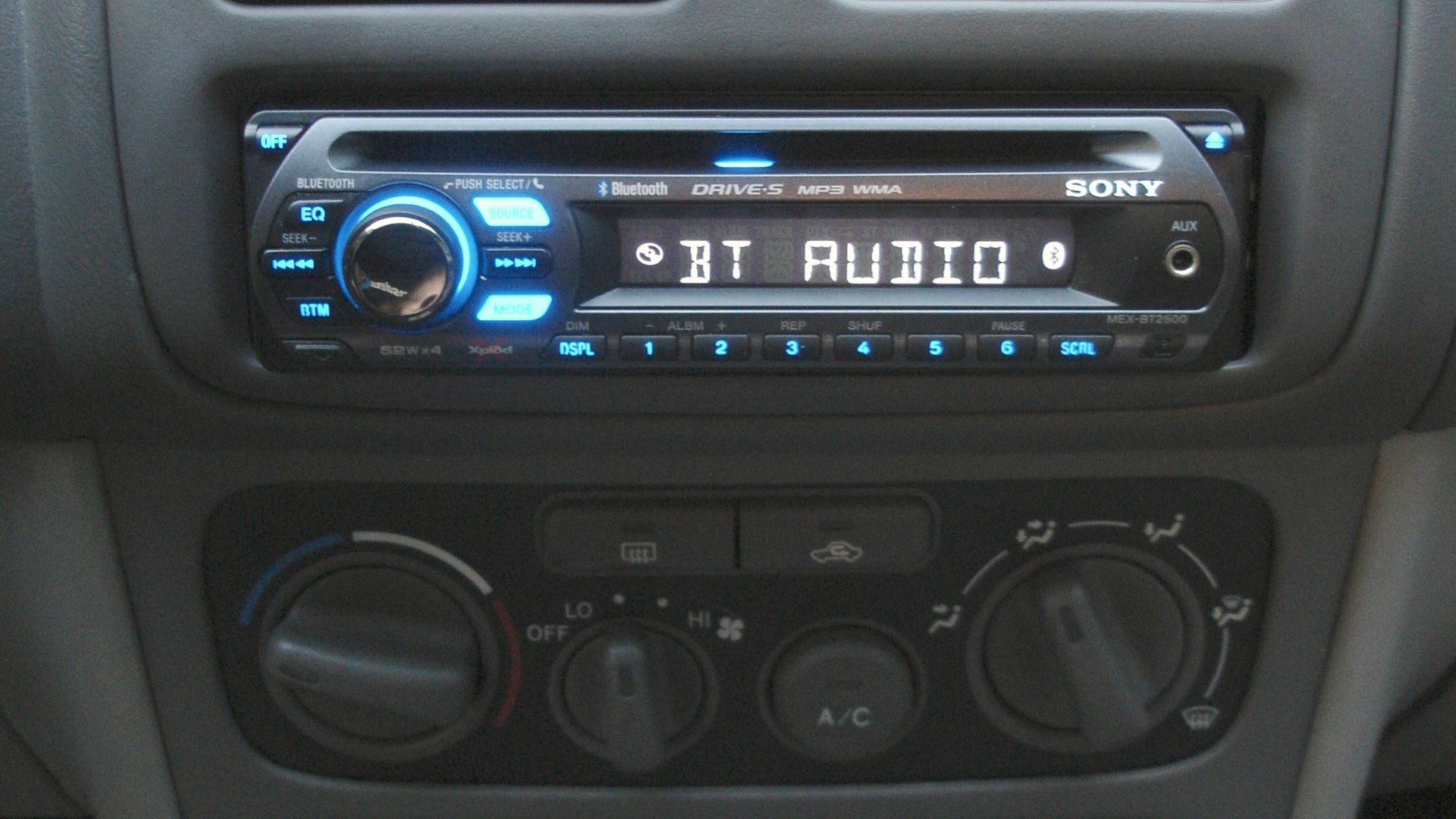 File:Car dashboard with MEX-BT2500 head unit and BCT-15 radio scanner installed and illuminated.jpeg