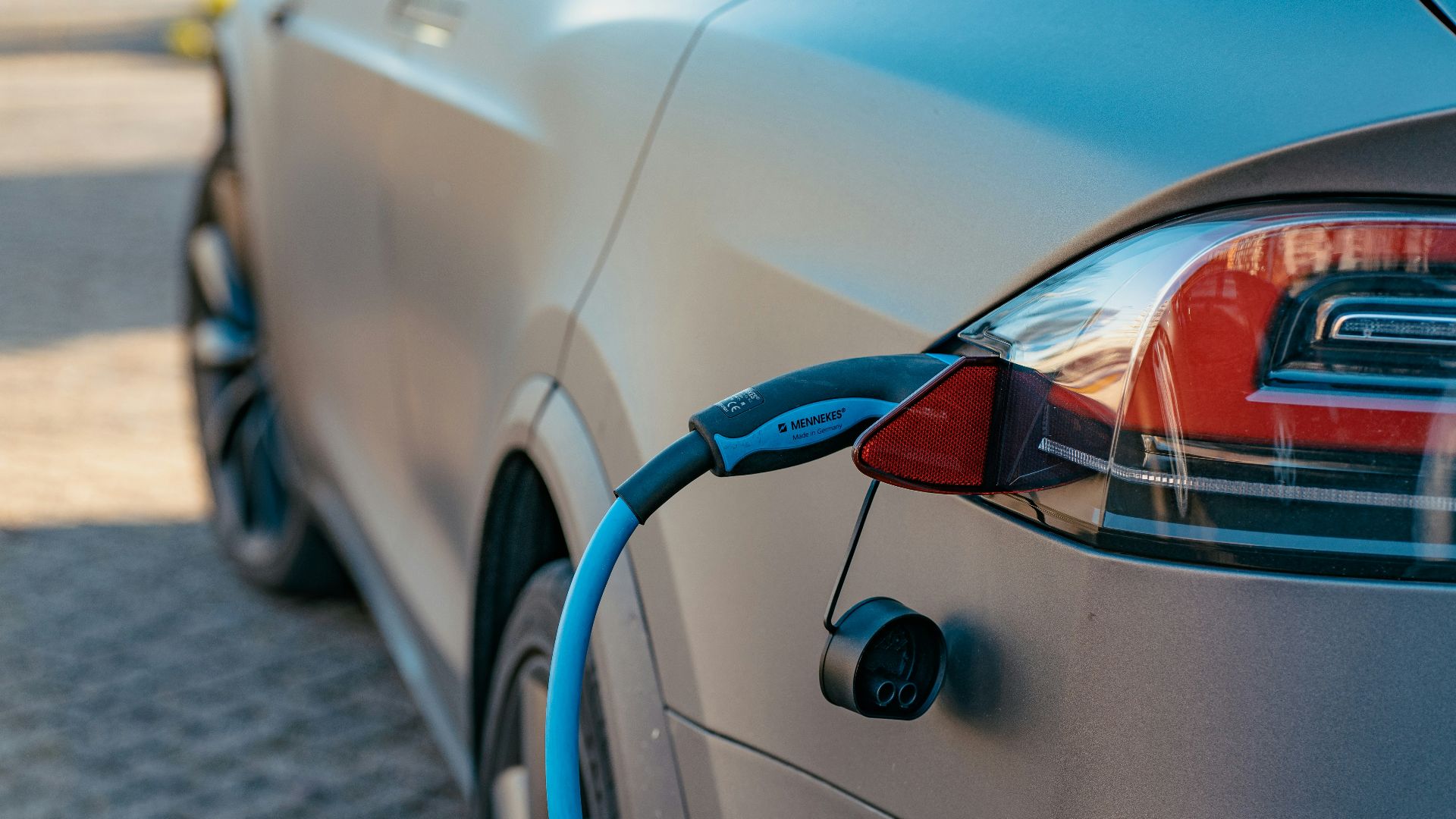 red and black car on road during daytime