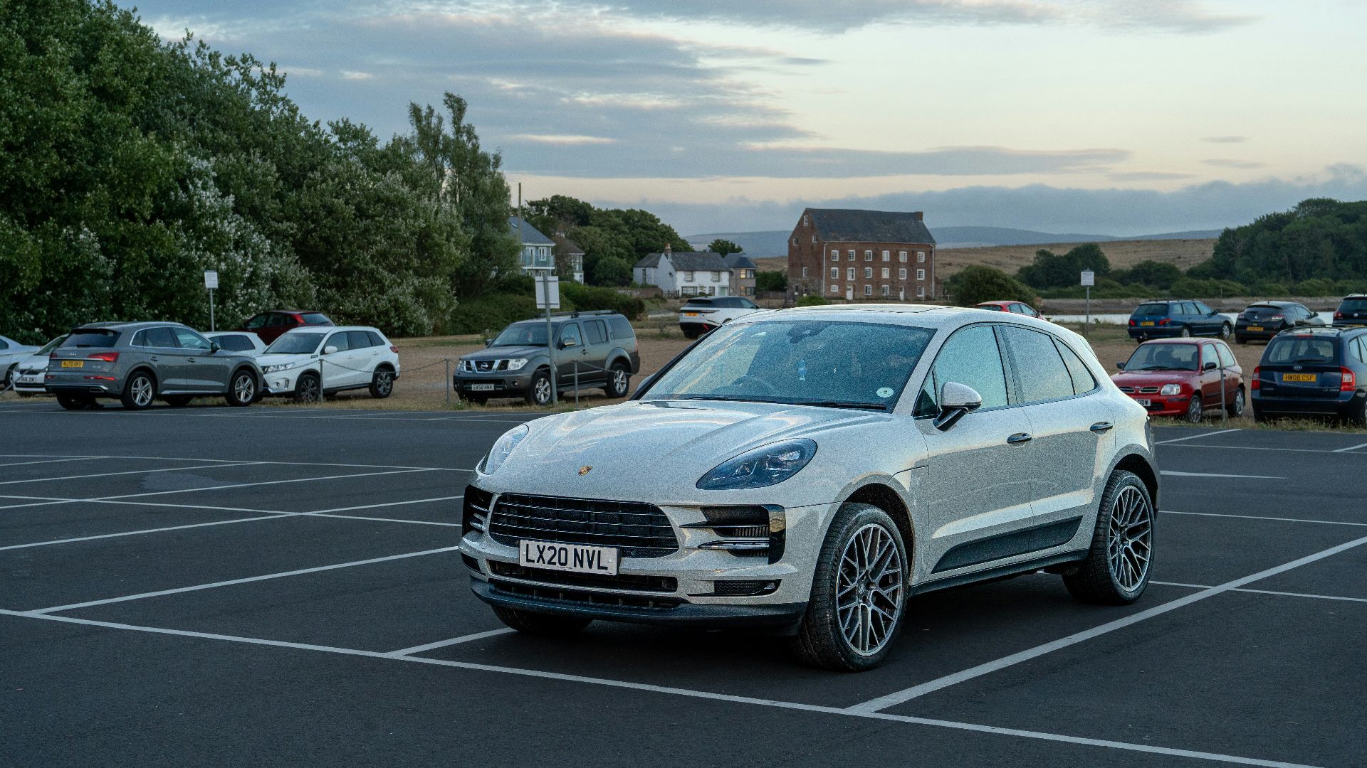 a white car parked in a parking lot