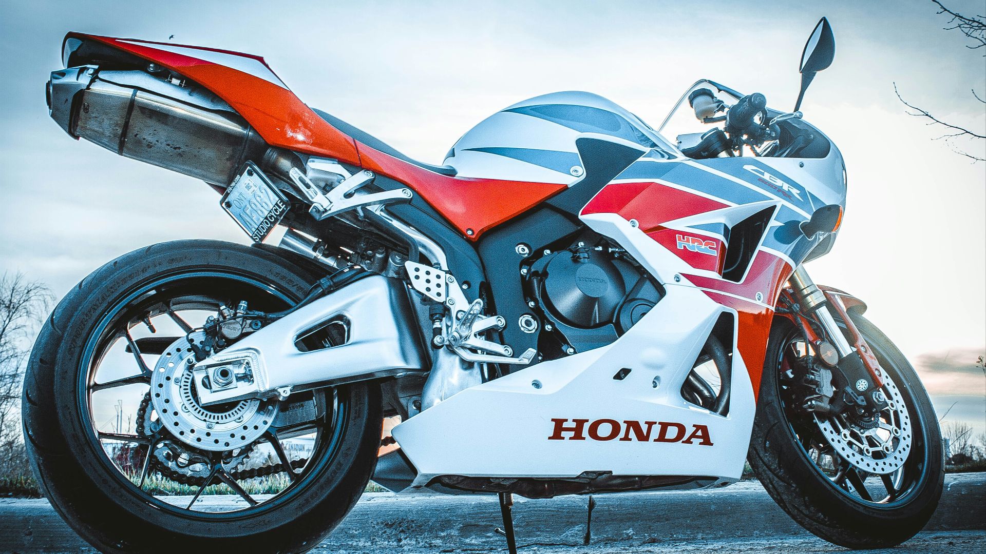 white and orange Honda sportbike