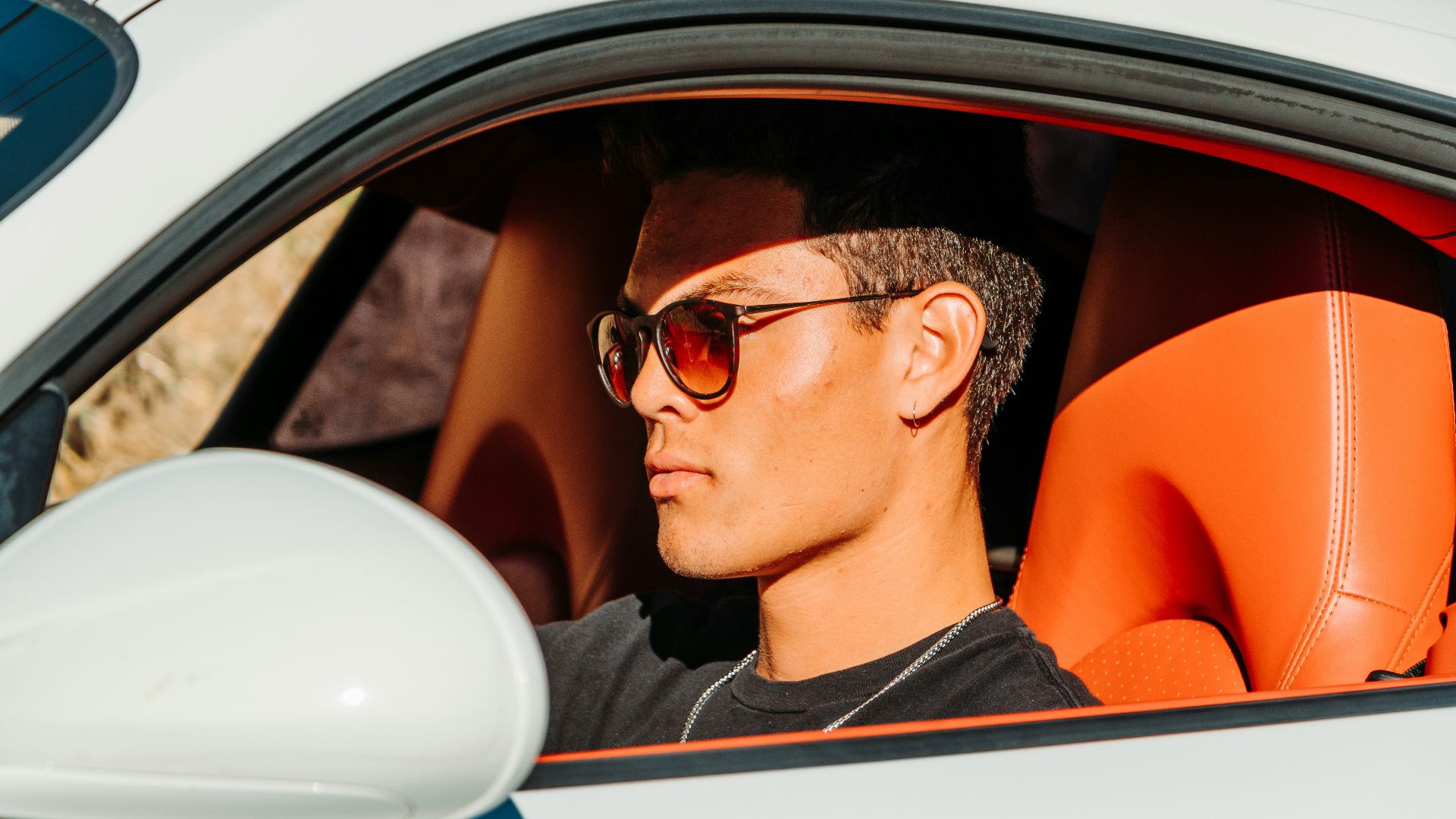 man inside white vehicle