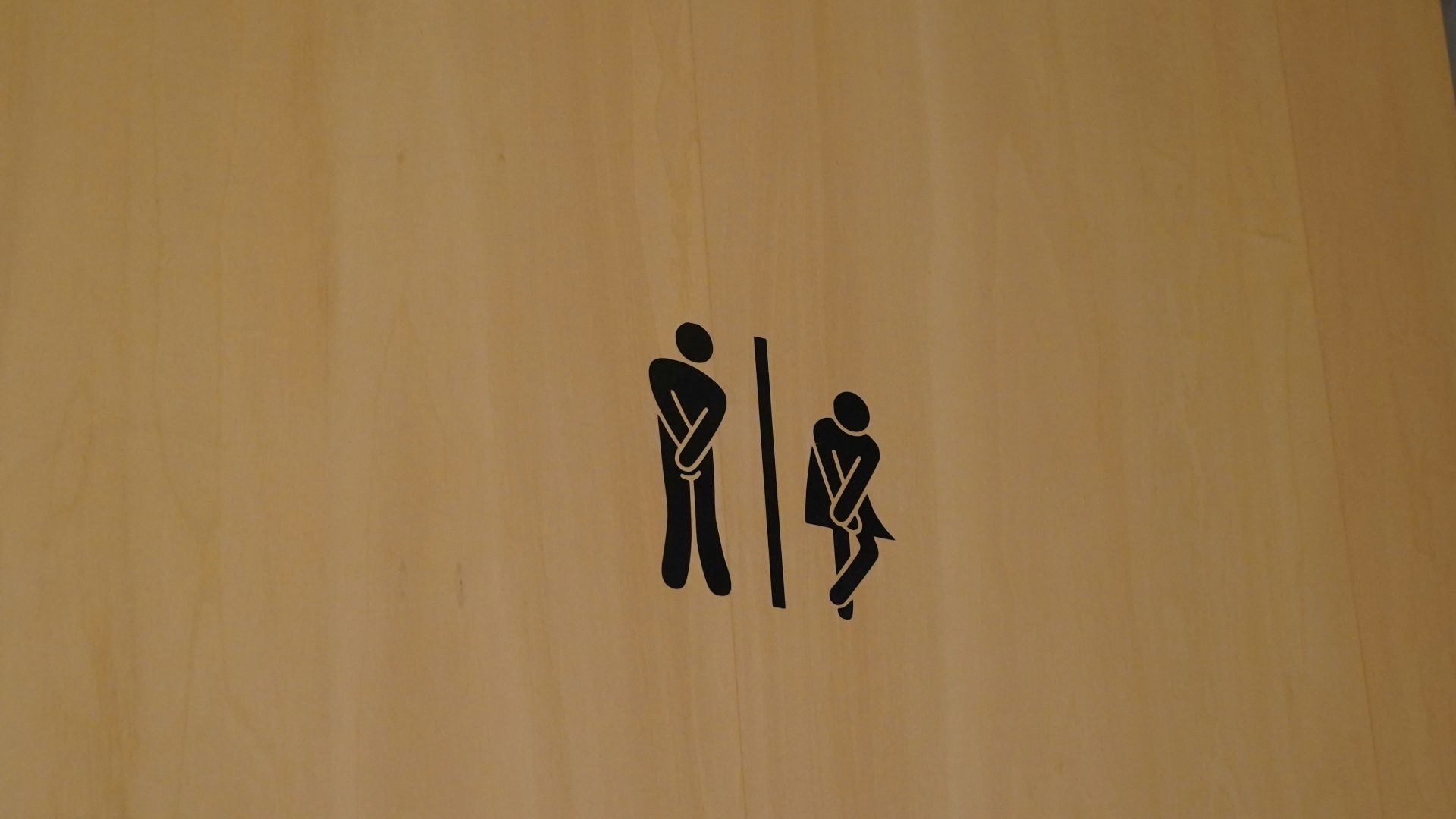 a wood door with black text on it