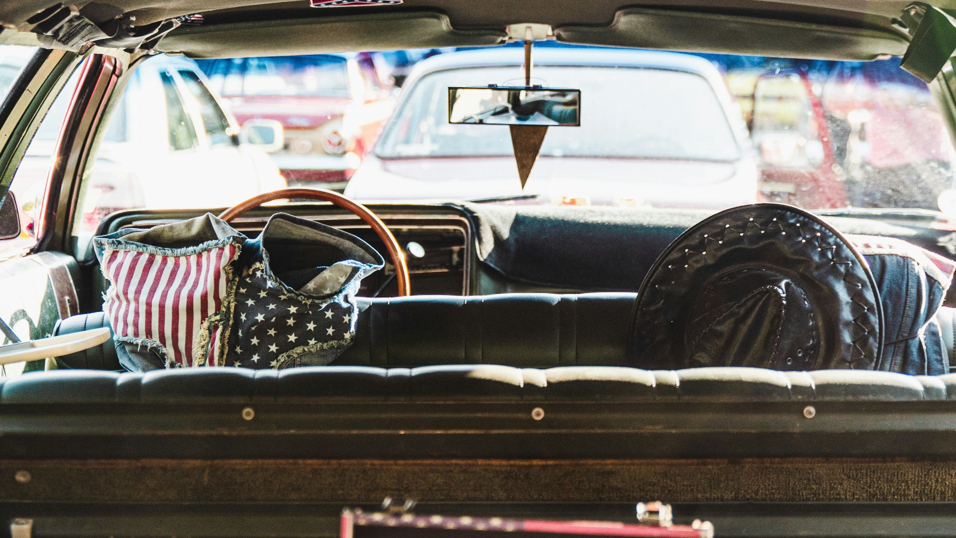 woman in black and white stripe shirt sitting on car seat