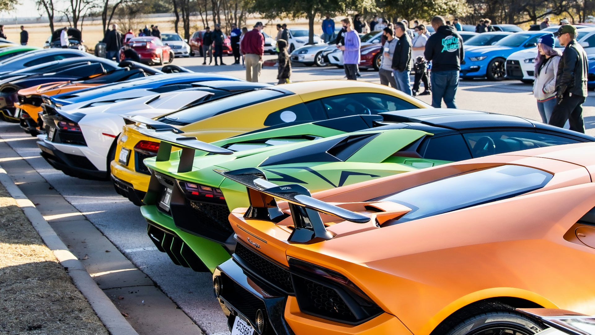 yellow ferrari sports car on parking lot during daytime
