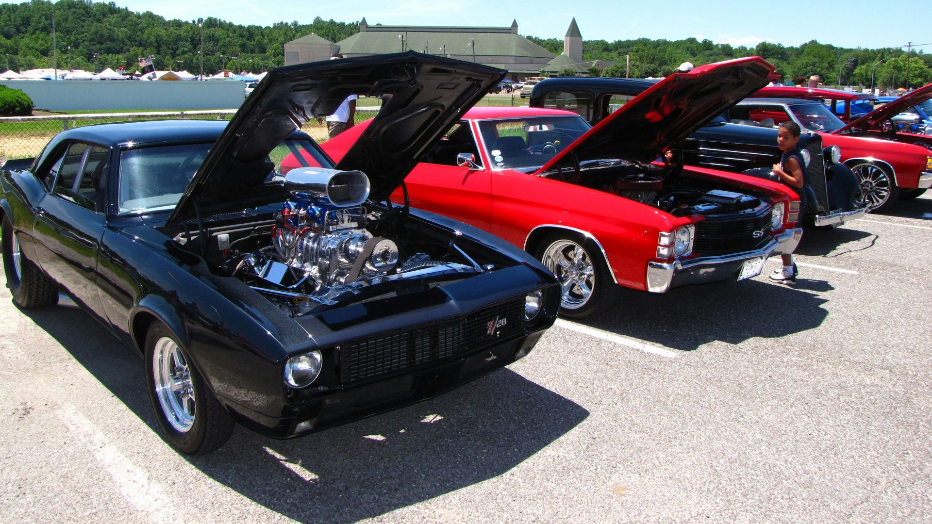 black bmw m 3 coupe parked on parking lot during daytime