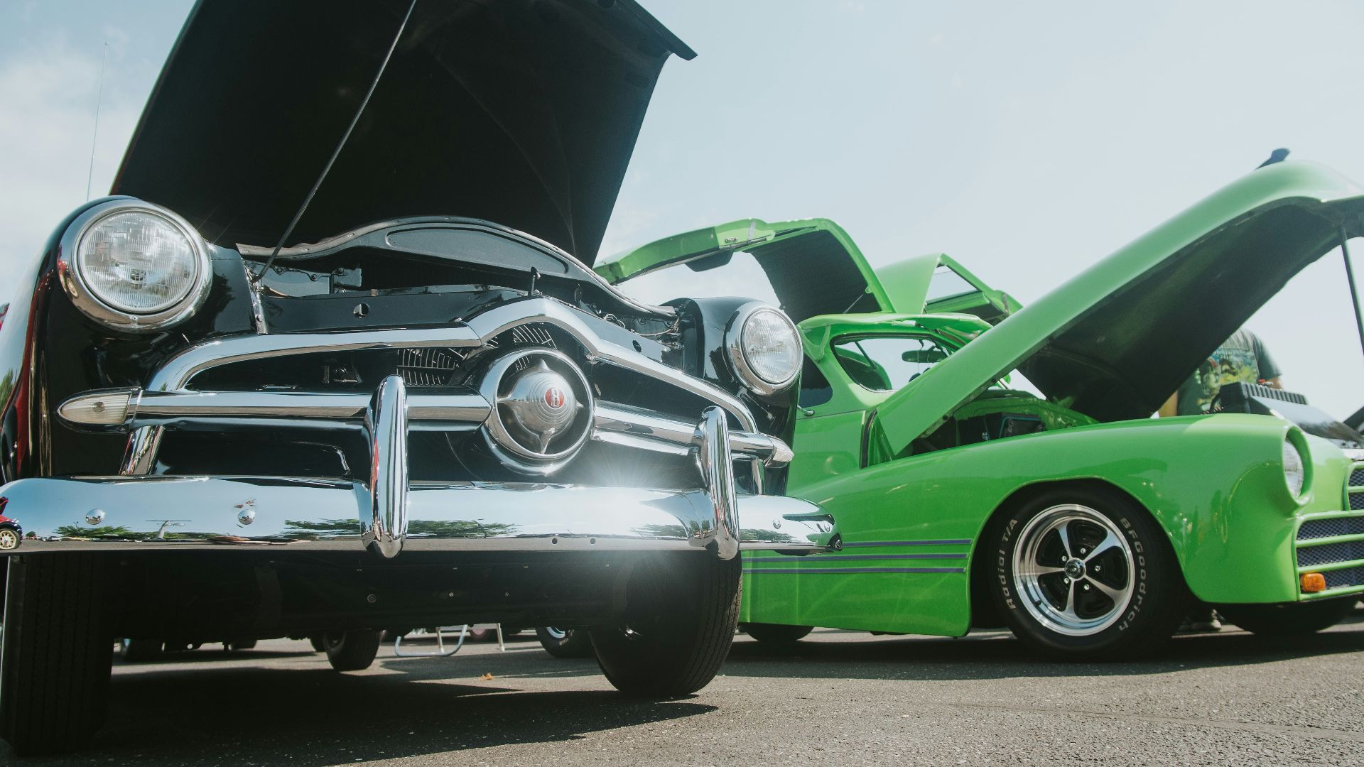 green classic car on road during daytime