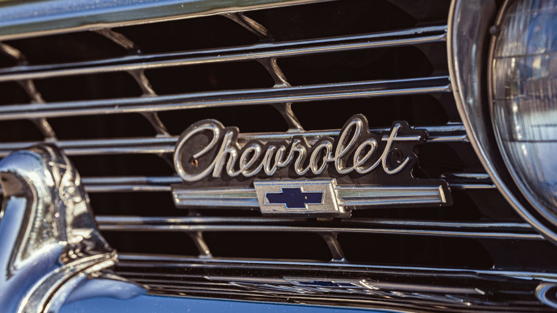 A close up of the front grill of a classic car