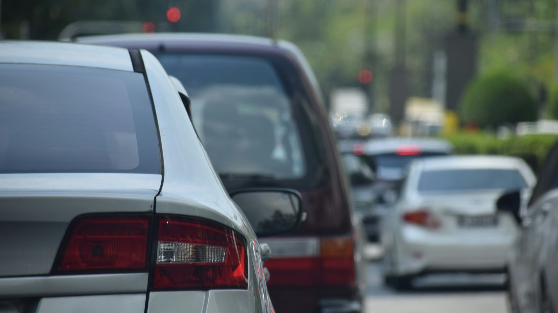 a bunch of cars that are parked in the street
