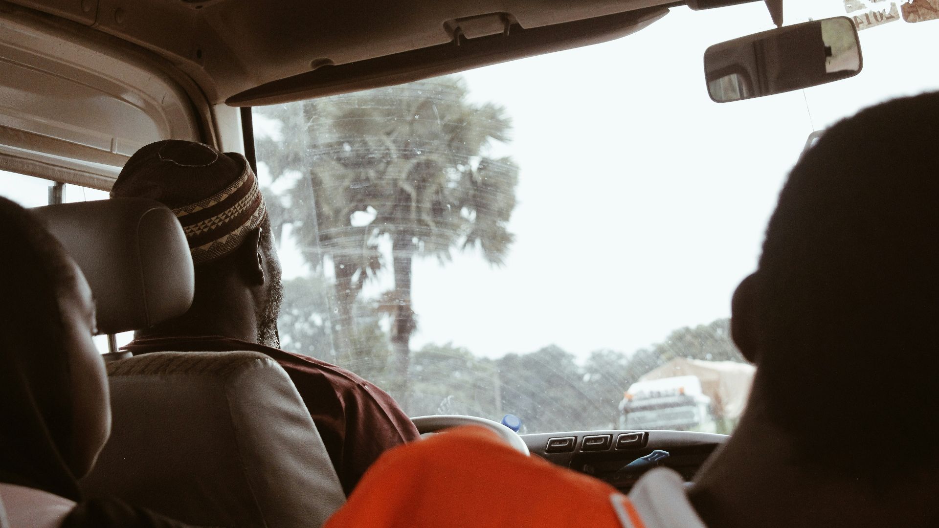 a group of people sitting in the back of a car