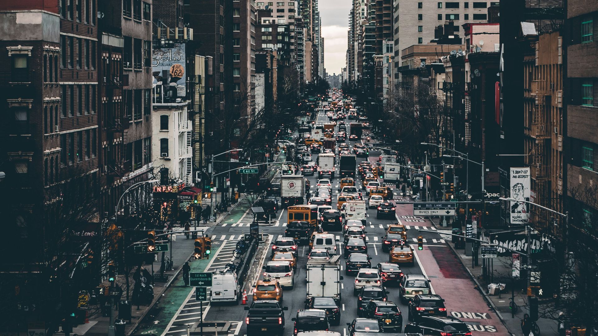 cars on road during traffic under gloomy skies