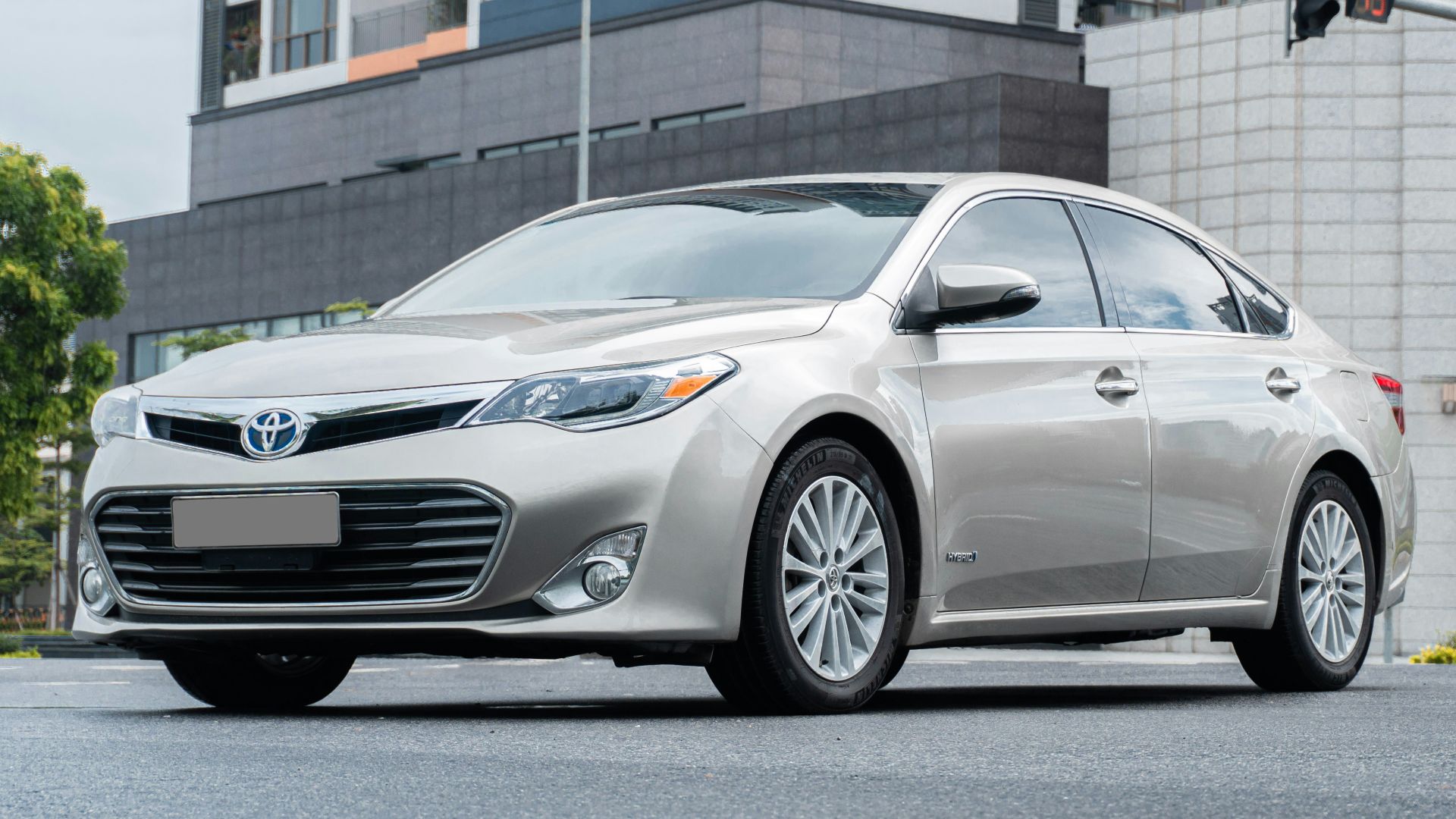 a silver car parked on the side of a road